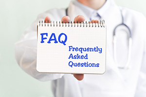 faq-written-n-pad-in-doctors-hand